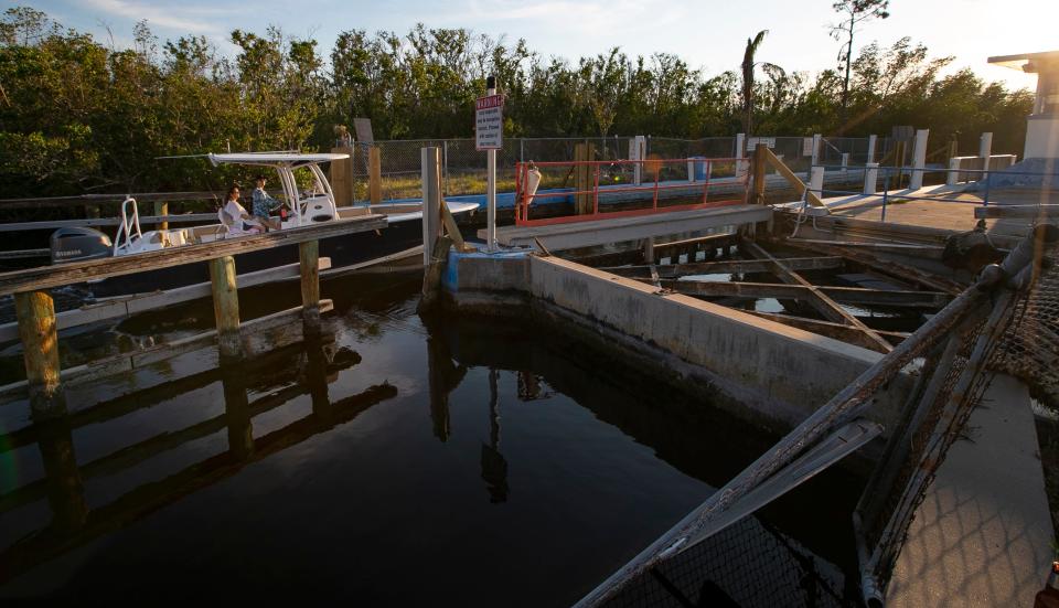 A boat makes its way through the Chiquita lock in Cape Coral Wednesday, March 1, 2023. The lock has been non-operational since being damaged by the impact of Hurricane Ian late September of last year.  