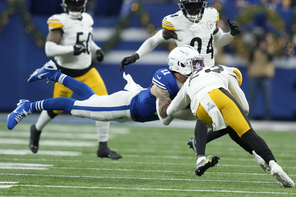 Indianapolis Colts wide receiver Michael Pittman Jr. (11) is hit by Pittsburgh Steelers safety Damontae Kazee (23) during the first half of an NFL football game in Indianapolis Saturday, Dec. 16, 2023. Pittman was injured on the play and Kazee was ejected from the game. (AP Photo/Michael Conroy)