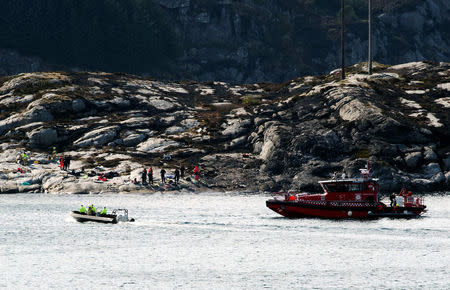 Rescuers work at a site where a helicopter has crashed west of the Norwegian city of Bergen April 29, 2016. NTB Scanpix/Marit Hommedal/via REUTERS