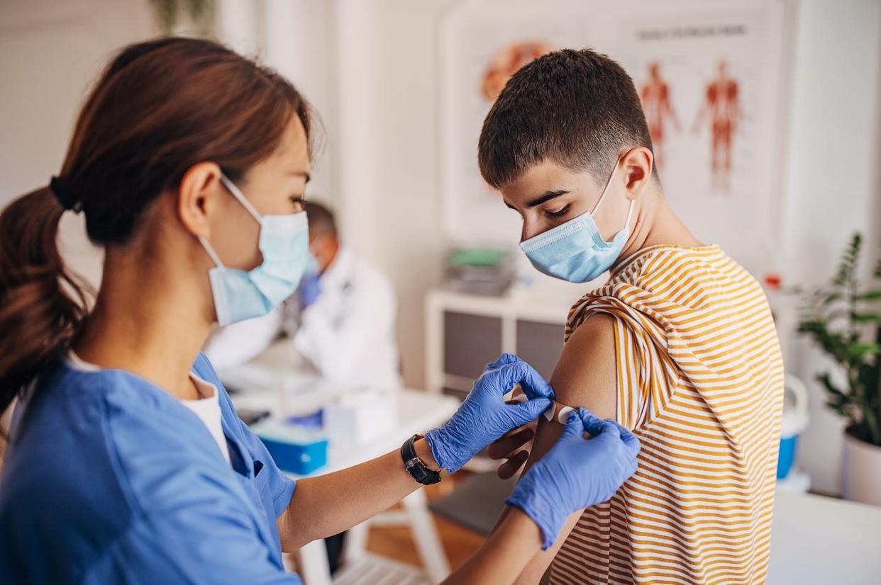 As of Nov. 30, 2022, 62.5% of children and adolescents are unvaccinated against COVID-19. <a href="https://www.gettyimages.com/detail/photo/nurse-putting-band-aid-on-patients-arm-after-covid-royalty-free-image/1340701756?phrase=nurses%20covid%20vaccines&adppopup=true" rel="nofollow noopener" target="_blank" data-ylk="slk:South_agency/E+ via Getty Images;elm:context_link;itc:0;sec:content-canvas" class="link ">South_agency/E+ via Getty Images</a>