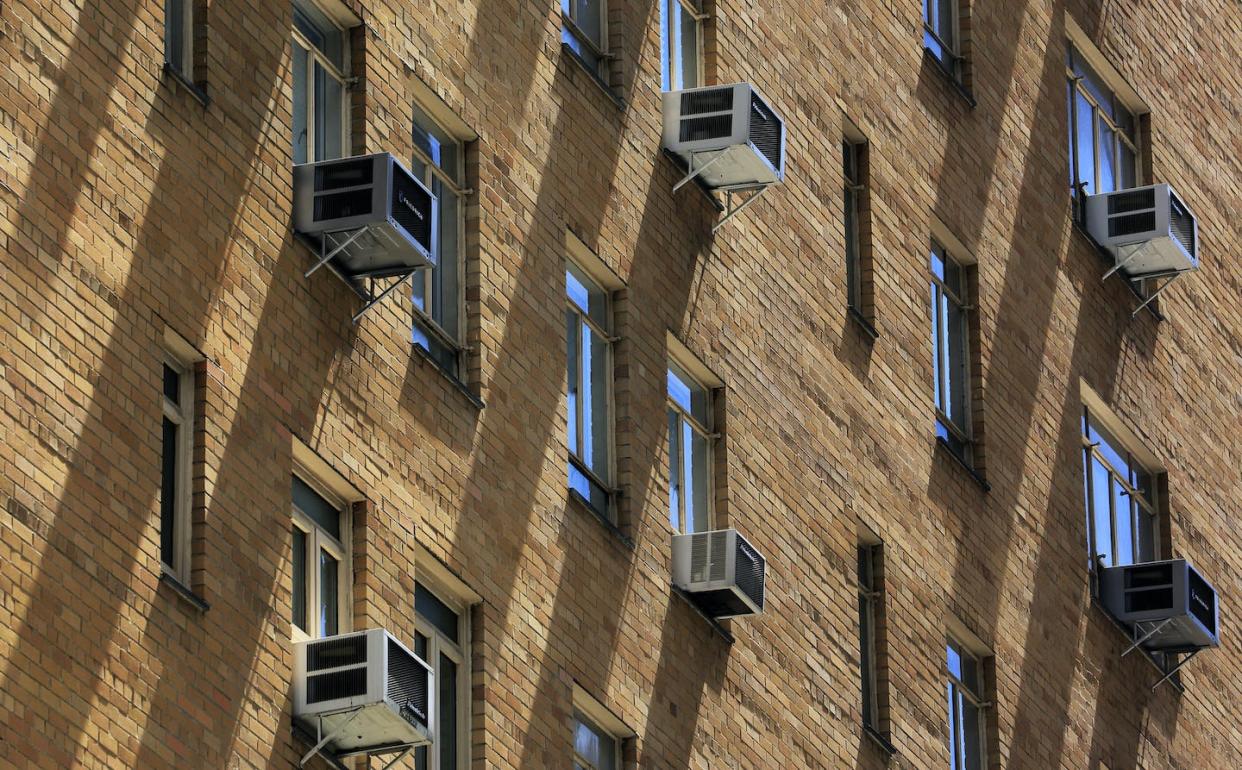 Air conditioners are one source of leaking HFCs. <a href="https://www.gettyimages.com/detail/photo/apartment-building-in-upper-west-of-manhattan-royalty-free-image/502986175?adppopup=true" rel="nofollow noopener" target="_blank" data-ylk="slk:Bruce Yuanyue Bi/The Image Bank via Getty Images;elm:context_link;itc:0;sec:content-canvas" class="link ">Bruce Yuanyue Bi/The Image Bank via Getty Images</a>
