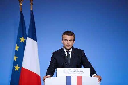 French President Emmanuel Macron addresses a speech during the annual gathering of French Ambassadors at the Elysee Palace in Paris