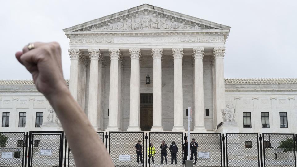 WASHINGTON DC - JUNE 23 Abortion rights and anti abortion protesters gathered in the rain outside the US Supreme Court on June 23, 2022 in Washington, DC. Both sides are awaiting a decision on the landmark Roe v. Wade case but none was issued on Thursday. (Photo by Michael Robinson Chavez/The Washington Post via Getty Images)