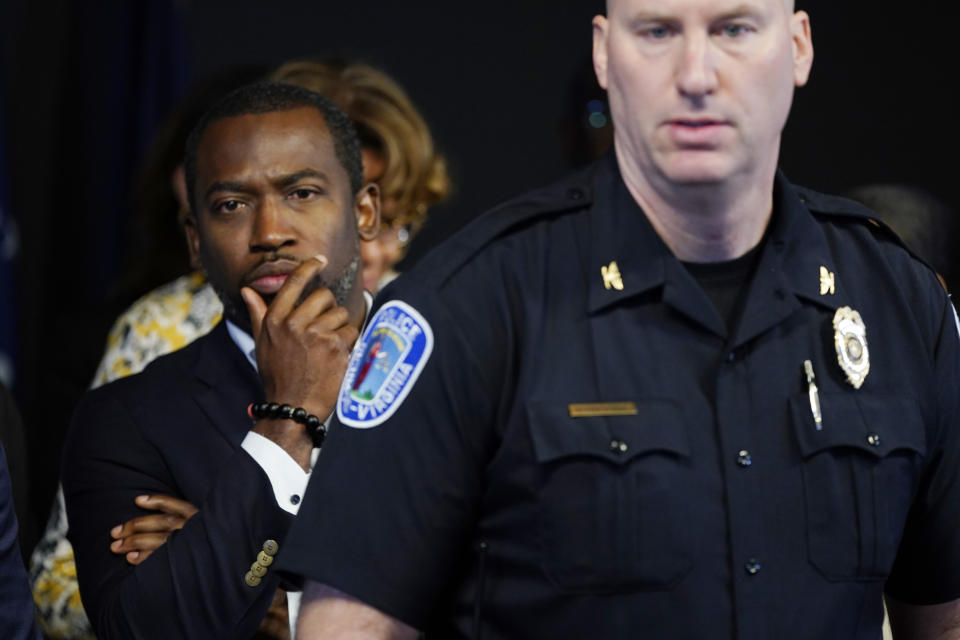 Richmond Mayor Levar Stoney, left, listens as Richmond interim Police Chief Rick Edwards, right, answers a question during a news conference concerning the shooting at the Altria Theater after a graduation ceremony Wednesday, June 7, 2023, in Richmond, Va. (AP Photo/Steve Helber)