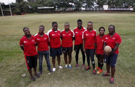 Members of the Kenya Women's Rugby team (L-R) Janet Okello, Irene Atieno, Shilla Chajira, Doreen Remour, Cynthia Camilla, Linet moraa, Mary Musieka and Philadelphia Orlando pose for a photograph after a light training session at the RFUEA grounds in the capital Nairobi, April 4, 2016. REUTERS/Thomas Mukoya