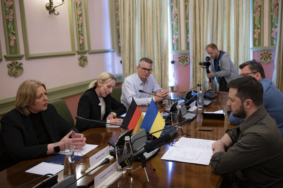 In this photo provided by the Ukrainian Presidential Press Office, Ukrainian President Volodymyr Zelenskyy, right, and Barbel Bas, President of Bundestag, German parliament speak, during their meting in Kyiv, Ukraine, Sunday, May 8, 2022. (Ukrainian Presidential Press Office via AP)