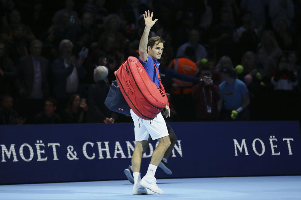 Roger Federer of Switzerland walks off court after losing to Alexander Zverev of Germany in their ATP World Tour Finals singles tennis match at the O2 Arena in London, Saturday Nov. 17, 2018. (AP Photo/Tim Ireland)