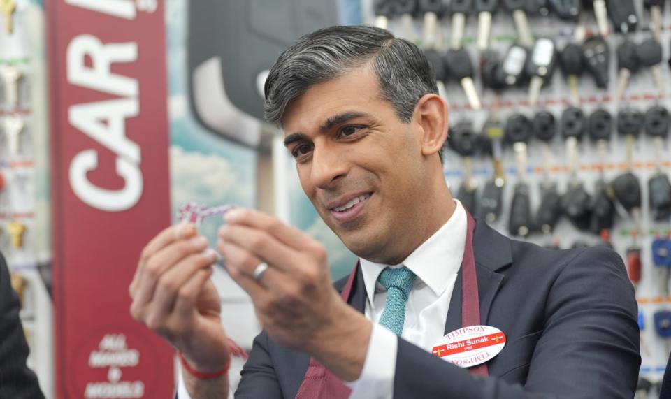 The PM visits a branch of Timpson after giving his speech on welfare reform in London on Friday (Yui Mok/PA)