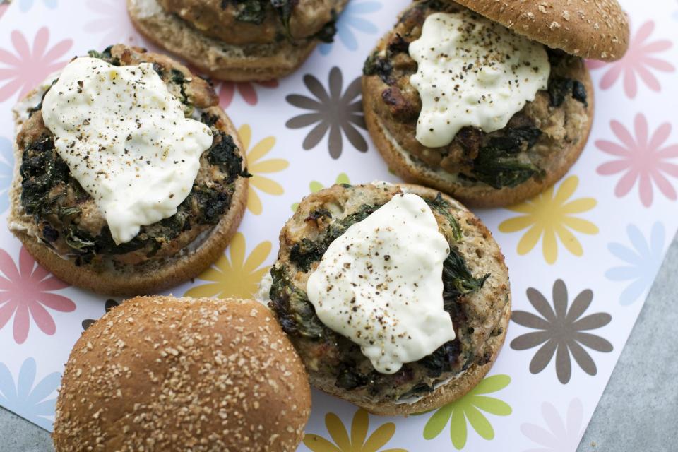 In this image taken on May 20, 2013, Greek-style turkey burgers with pepperoncini sauce are shown in Concord, N.H. (AP Photo/Matthew Mead)