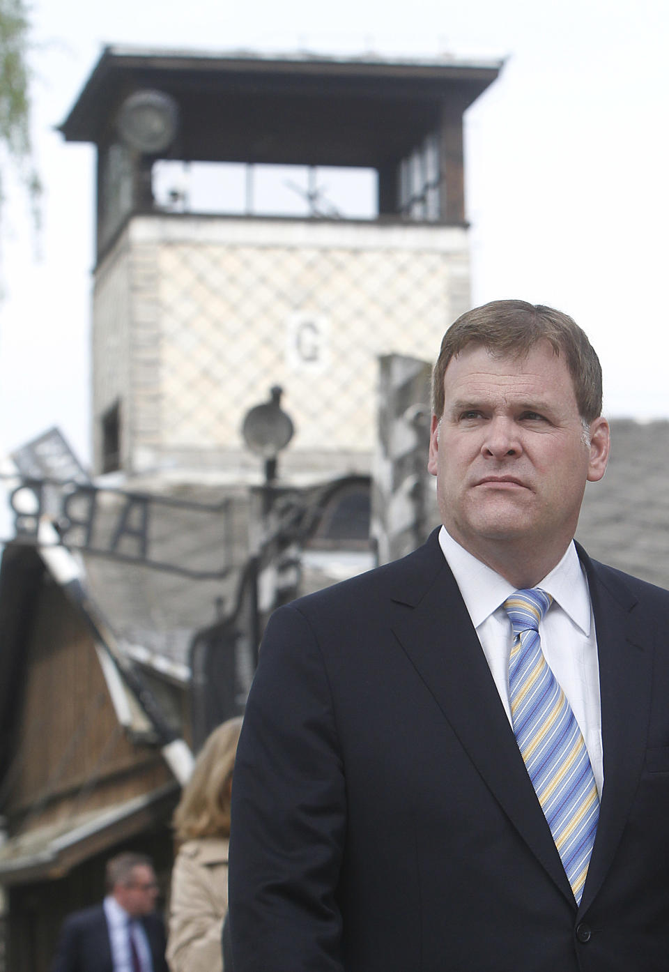 Canada’s Foreign Minister John Baird walks past the gate of the World War II Nazi German death camp of Auschwitz in Oswiecim, Poland Thursday, April 24, 2014. Between 1940-45, the German Nazis killed over 1.1 million people, mostly Jews, in Auschwitz and in neighboring Birkenau. Baird also visited an exhibition that documents the atrocities and preserves the memory of the victims. He placed white and red roses at the Executions Wall, where inmates, chiefly Polish resistance fighters, were shot. (AP Photo/Czarek Sokolowski)