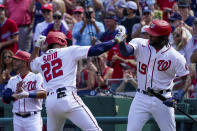 Washington Nationals' Juan Soto celebrates with teammate Josh Bell (19) after hitting a solo home run during the third inning of a baseball game against the Colorado Rockies at Nationals Park, Sunday, Sept. 19, 2021, in Washington. (AP Photo/Andrew Harnik)