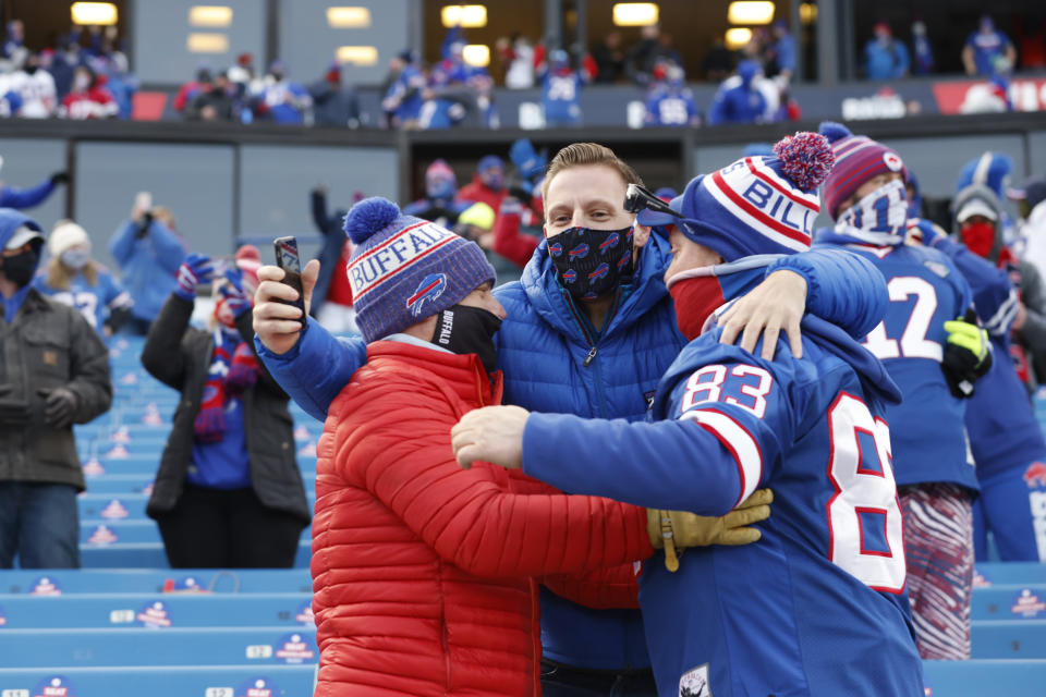 Fans celebrate after the Buffalo Bills beat the Colts 27-24 in a wild-card playoff game. (Photo by Bryan M. Bennett/Getty Images)