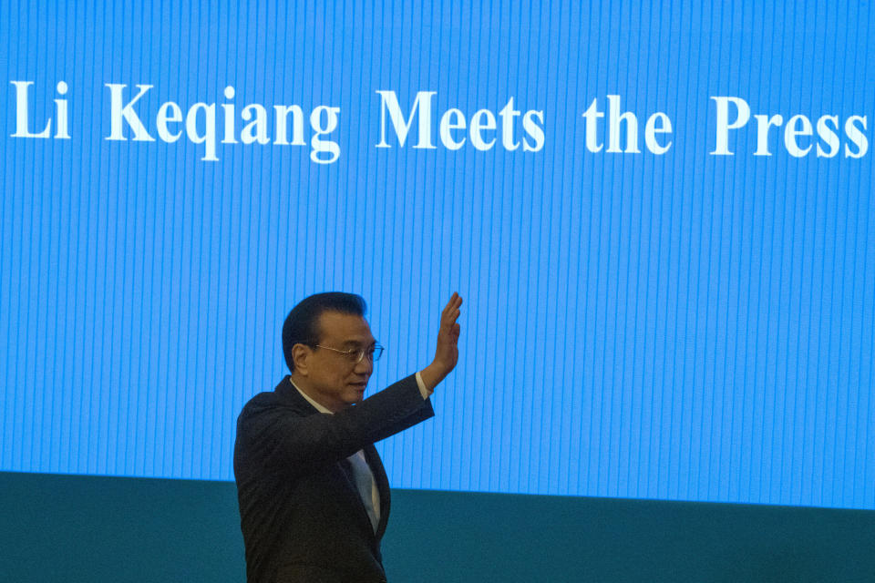 Chinese Premier Li Keqiang arrives for a press conference after the closing session of the National People's Congress in Beijing's Great Hall of the People on Friday, March 15, 2019. (AP Photo/Ng Han Guan)