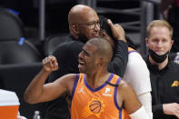 Phoenix Suns head coach Monty Williams, left, hugs Jae Crowder, second from right, while guard Chris Paul celebrates as time runs out in Game 6 of the NBA basketball Western Conference Finals against the Los Angeles Clippers Wednesday, June 30, 2021, in Los Angeles. The Suns won the game 130-103 to take the series 4-2. (AP Photo/Mark J. Terrill)