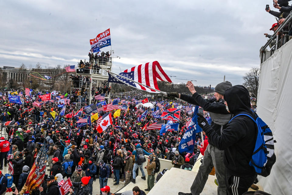 Trump supporters clash with police and security forces as they invade the Inauguration platform of the U.S. Capitol in Washington, DC on Jan. 6, 2021. (Roberto Schmidt / AFP via Getty Images file)