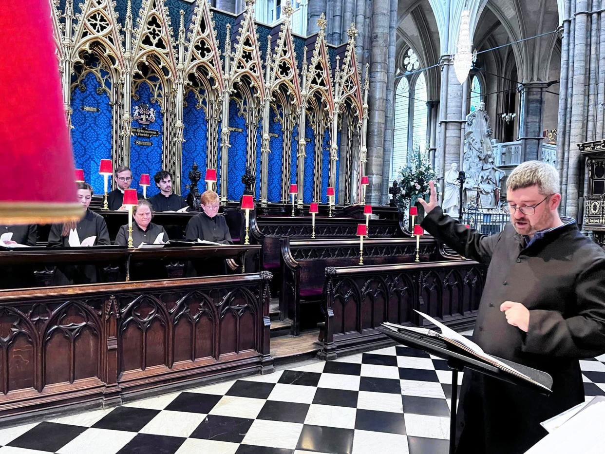 Simon Ballintoy leads the St. Stephen’s Choir in rehearsal at Westminster Abbey.