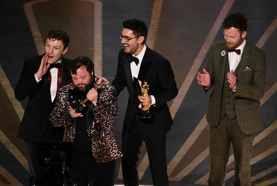 Filmmakers Ross White, James Martin, Tom berkeley and Seamus O’Hara accept the Oscar for Best Live Action Short Film for “An Irish Goodbye” onstage during the 95th Annual Academy Awards at the Dolby Theatre in Hollywood, California (AFP via Getty Images)