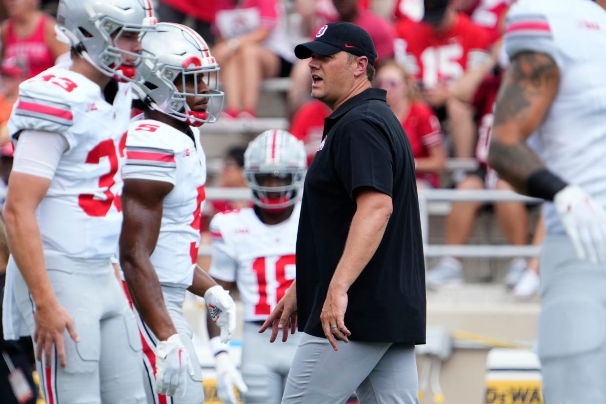 Sep 2, 2023; Bloomington, Indiana, USA; Ohio State Buckeyes offensive line coach Justin Frye watches warm ups prior to the NCAA football game at Indiana University Memorial Stadium. Ohio State won 23-3.