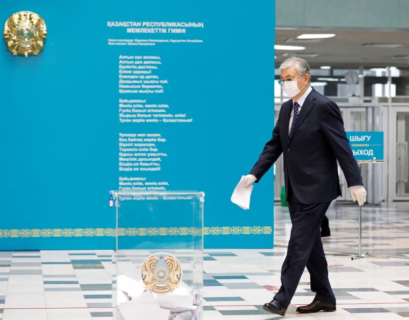 Kazakhstan's President Kassym-Jomart Tokayev casts his ballot during parliamentary election in Nur-Sultan