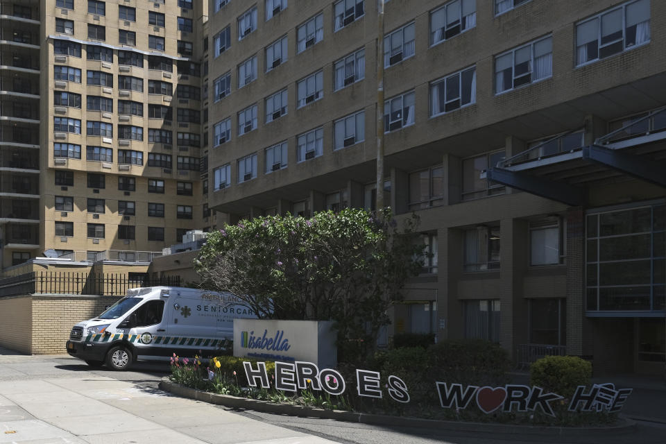 An ambulance leaves the Isabella Center in New York, Tuesday, May 5, 2020. New York state is reporting more than 1,700 previously undisclosed deaths at nursing homes and adult care facilities as the state faces scrutiny over how it's protected vulnerable residents during the coronavirus pandemic. (AP Photo/Seth Wenig)
