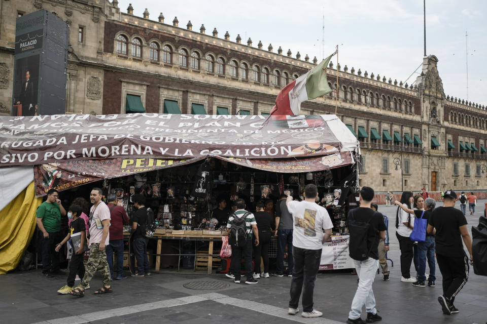 A stall stands outside the presidential palace, selling souvenirs of Mexican President Andrés Manuel López Obrador, in Mexico City, Friday, March 15, 2024. Despite not being eligible to run for reelection in the upcoming June 2 presidential vote, López Obrador looms larger than any of the candidates competing for the helm of Mexico’s government. (AP Photo/Eduardo Verdugo)