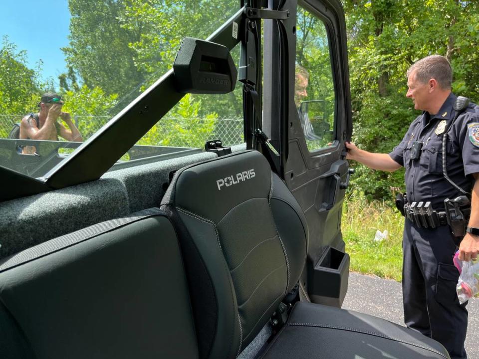 Swansea Police Chief Matt Blomberg talks to an unidentified man staying in a squatters camp along MetroBikeLink Trail last week. The man turned down supplies and promised to move. Teri Maddox/tmaddox@bnd.com