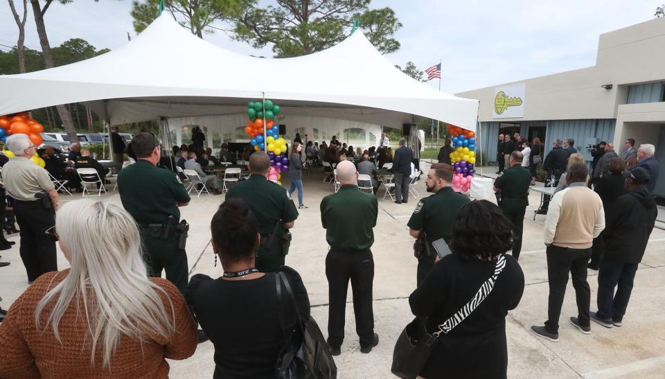 A large crowd of officials and partners gathers Thursday, Nov. 17, 2022, for the ribbon-cutting for the Volusia Family Resource Center.