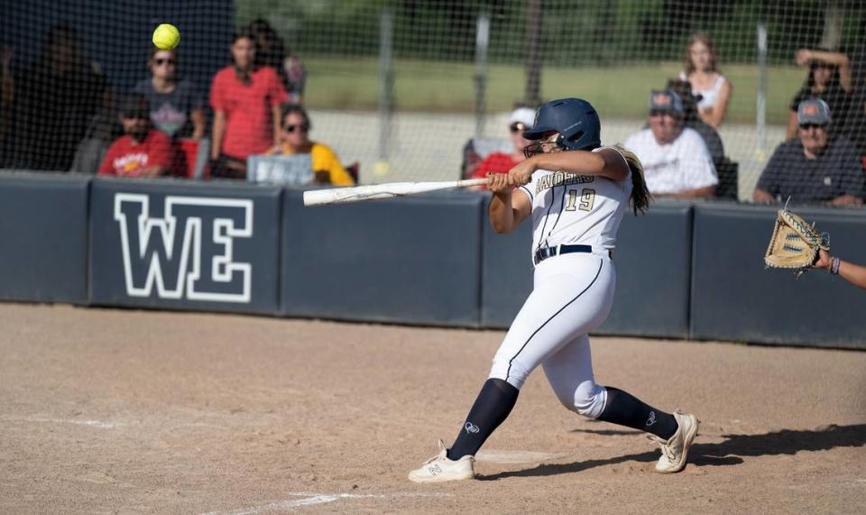 Central Catholic’s Jazzelyn Rios connects on a double driving in the winning run in the seventh inning of the Sac-Joaquin Section Division III semifinal game with Oakdale at Central Catholic High School in Modesto, Calif., Tuesday, May 23, 2023.