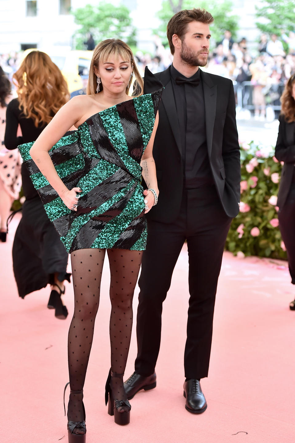 A photo of Miley Cyrus and Liam Hemsworth on the Met Gala red carpet in May 2019.