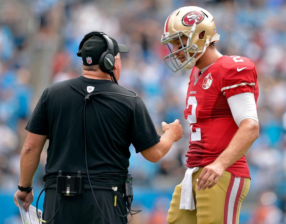 Chip Kelly talks to Blaine Gabbert during a game (Getty Images)