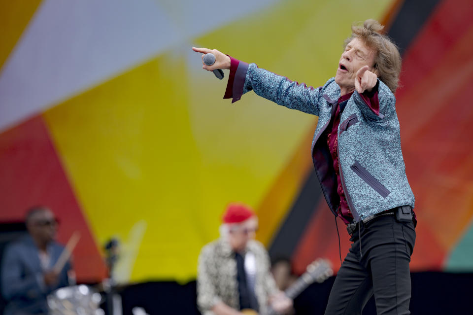 Mick Jagger, right, and Keith Richards, center background, of the Rolling Stones, perform during the New Orleans Jazz and Heritage Festival in New Orleans, Thursday, May 2, 2024. (AP Photo/Matthew Hinton)
