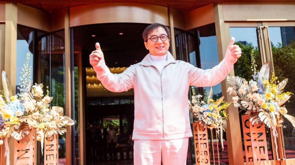 jackie chan attends commercial event in hangzhou
