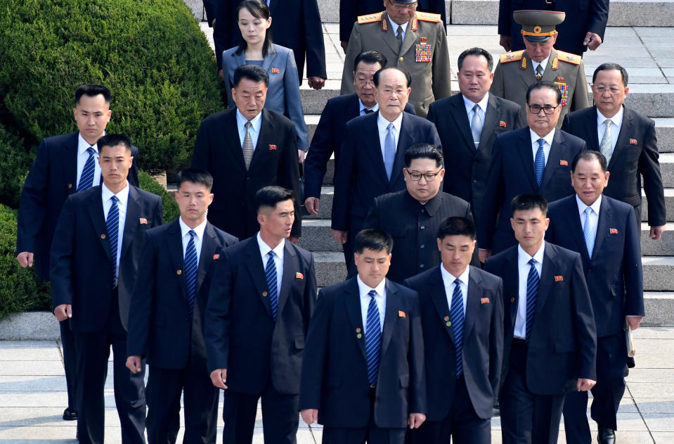 FILE - In this April 27, 2018, file photo, North Korean leader Kim Jong Un, center, is surrounded by his security guards upon his arrival for a meeting with South Korean President Moon Jae-in at the North Korean side of Panmunjom in the Demilitarized Zone. Kim and South Korean President Moon Jae-in announced in the North Korean capital of Pyongyang this week that Kim has accepted Moon’s request to visit Seoul soon, maybe within the year. (Korea Summit Press Pool via AP, File)