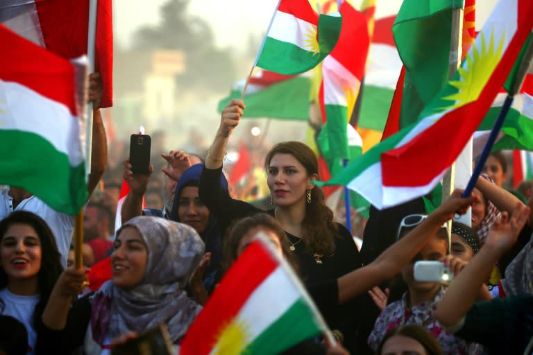 Syrian Kurds take part in a rally in Qamishli on September 15, 2017 in support of a planned independence referendum by Iraqi Kurds