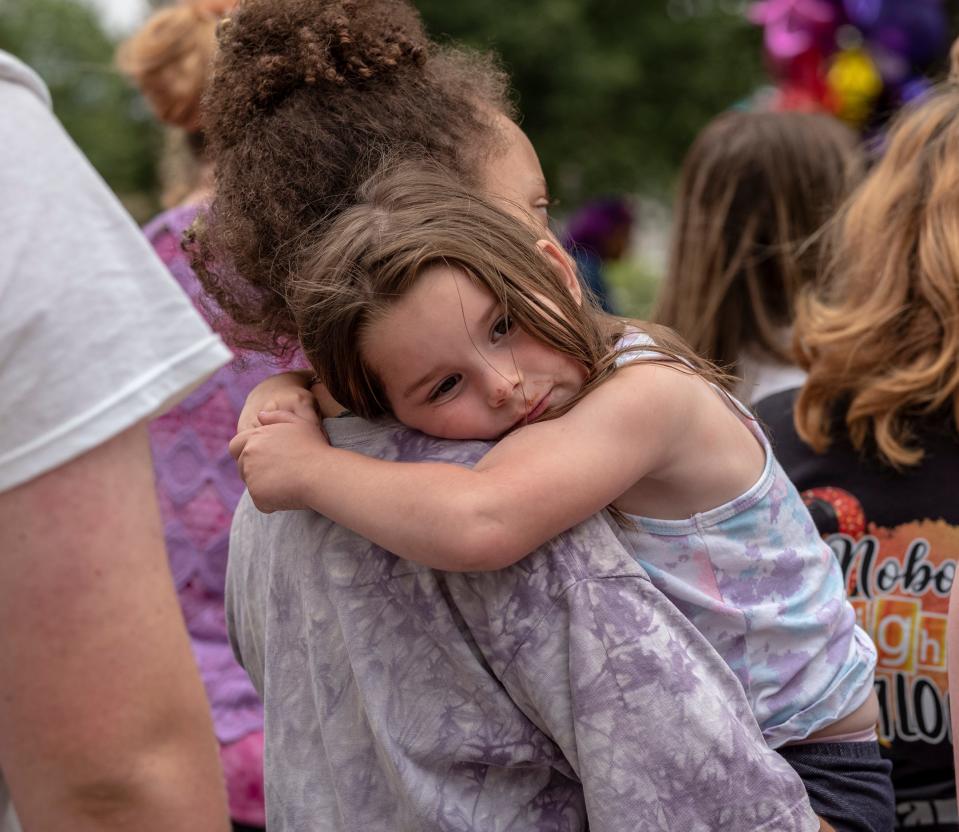 Adeline Feldpausch, 4, finds comfort being held by Joy Williams during the vigil for Wynter Cole-Smith Saturday, July 8, 2023 at the Capitol. 
