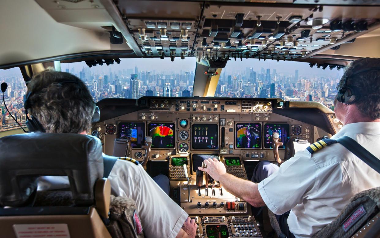 what happens plane cockpit autopilot on - Getty