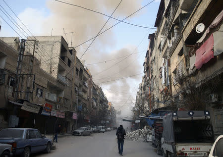 Smoke from an air raid rises in the besieged town of Douma, Eastern Ghouta, Damascus, Syria February 23, 2018. REUTERS/Bassam Khabieh