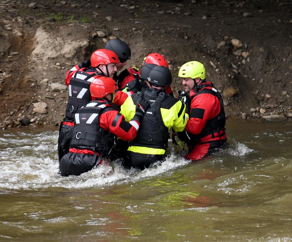 Fire departments from Massillon, Jackson Township and Wooster Township participate in a water rescue course through Dive Rescue International along the Tuscarawas River in Massillon.