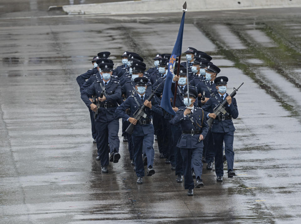 Hong Kong police show their new goose step marching style on the National Security Education Day at a police school in Hong Kong Thursday, April 15, 2021. Authorities marked the event with a police college open house, where police personnel demonstrated the Chinese military’s goose step march, replacing British-style foot drills from the time Hong Kong was ruled by the U.K. until the 1997 handover to China. (AP Photo/Vincent Yu)