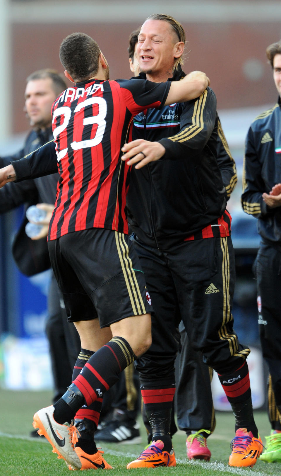 AC Milan's Adel Taarabt, left, hugs teammate Philippe Mexes after scoring during a Serie A soccer match between Sampdoria and AC Milan, at the Luigi Ferraris stadium in Genoa, Italy, Sunday, Feb. 23, 2014. (AP Photo / Carlo Baroncini)