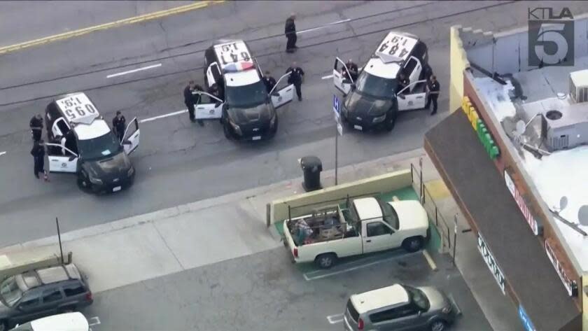 L.A. police on the scene of a Mission Hills standoff with a man reportedly armed with a chainsaw.
