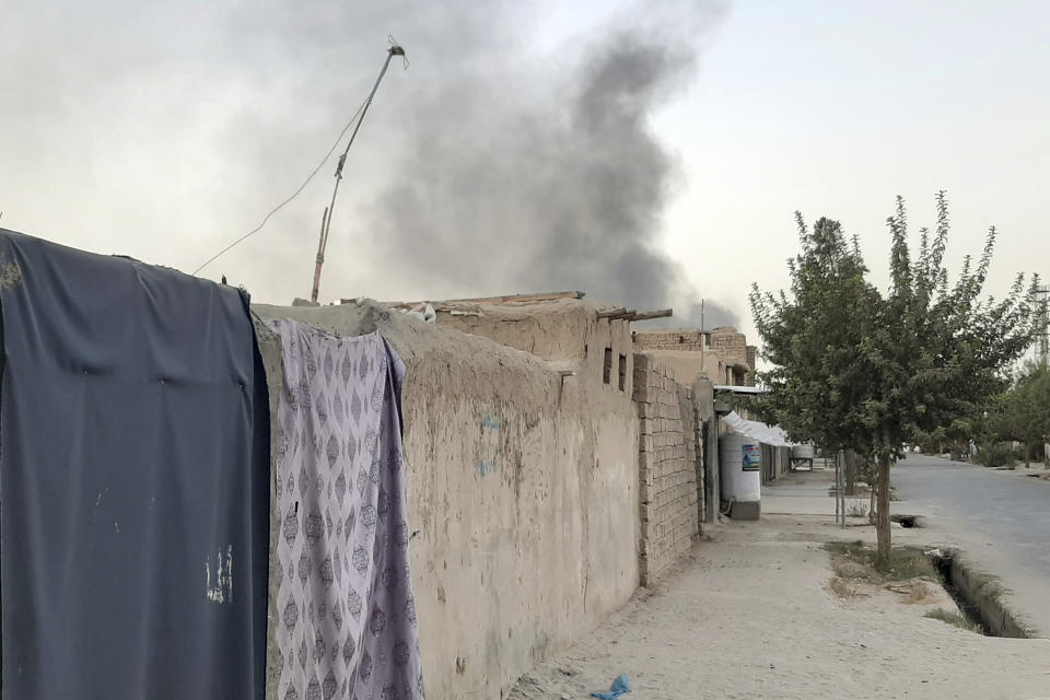 Smoke rises from the city of Lashkar Gah after airstrikes against Taliban in Helmand province southern of Kabul, Afghanistan, Friday, Aug. 6, 2021. The Afghan air force carried out more airstrikes against Taliban positions in southern Afghanistan on Thursday, as the insurgent force made additional gains in the country's north. (AP Photo/Abdul Khaliq)