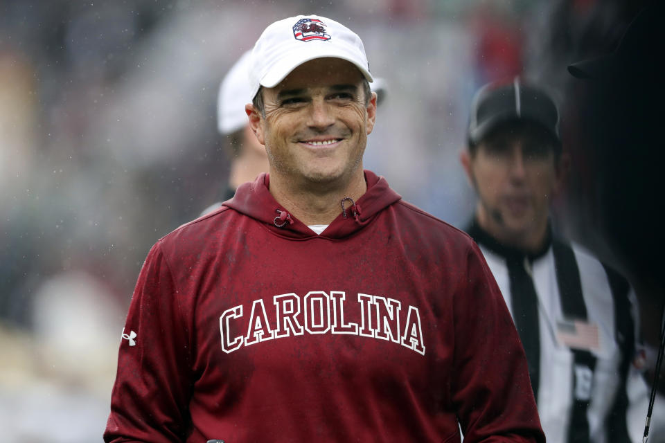 South Carolina head coach Shane Beamer is all smiles after taking a 13-0 lead during the first half of an NCAA college football game against Vanderbilt, Saturday, Nov. 11, 2023, in Columbia, S.C. (AP Photo/Artie Walker Jr.)