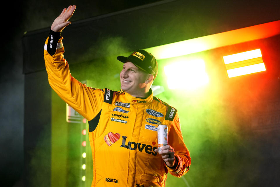 Michael McDowell waves to fans during driver introductions before the two Daytona 500 qualifying auto races at Daytona International Speedway, Thursday, Feb. 15, 2024, in Daytona Beach, Fla. (AP Photo/John Raoux)