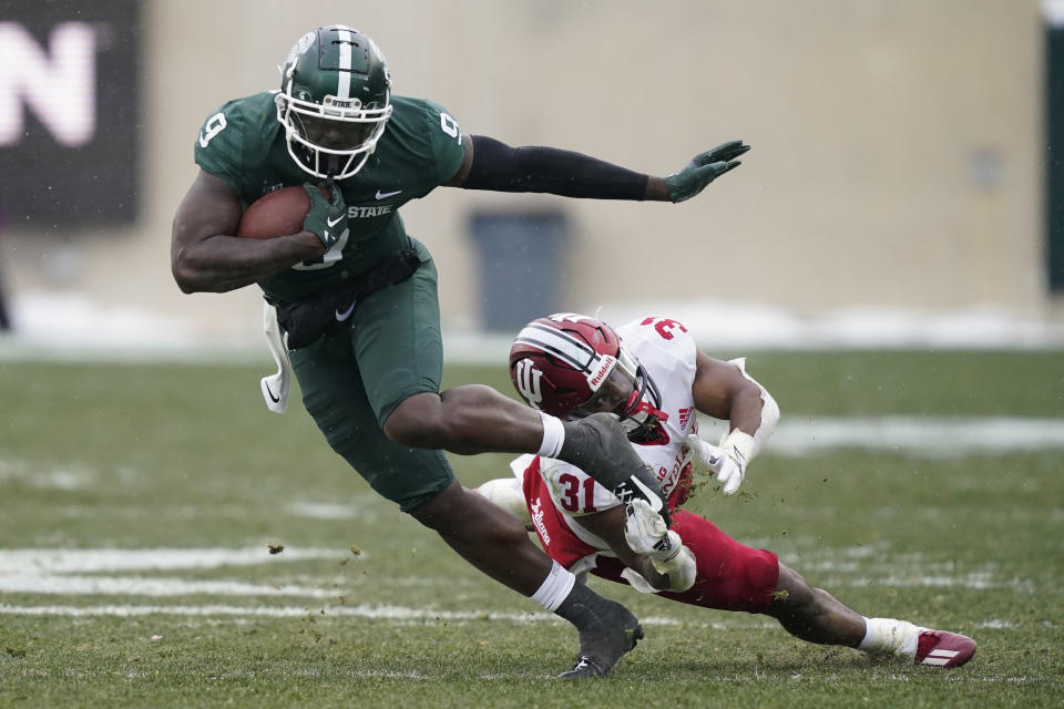Michigan State tight end Daniel Barker (9) breaks away from Indiana defensive back Bryant Fitzgerald (31) during the second half of an NCAA college football game, Saturday, Nov. 19, 2022, in East Lansing, Mich. (AP Photo/Carlos Osorio)