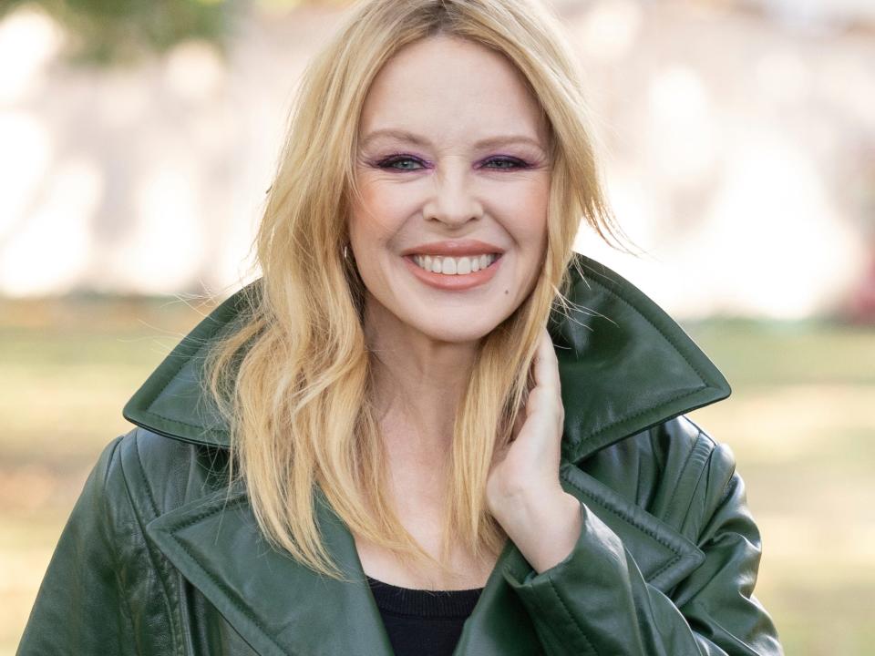 Kylie Minogue poses for photographers upon arrival at the Burberry Spring Summer 2024 fashion show on Monday, Sept. 18, 2023 in London.