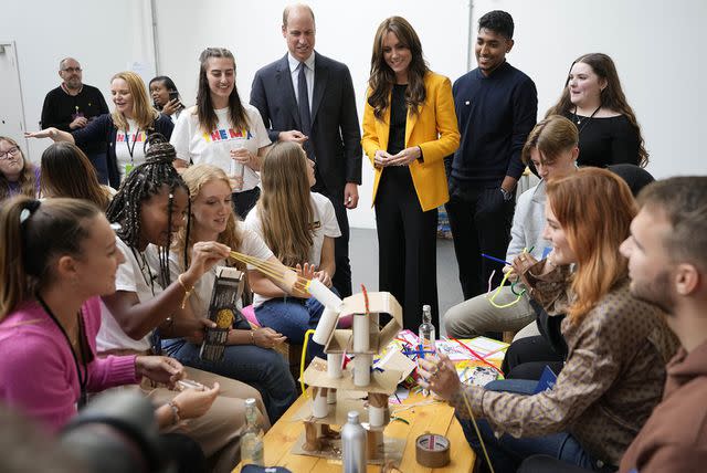 <p>Kirsty Wigglesworth-WPA Pool/Getty Images</p> Prince William and Princess Kate join in the workshops