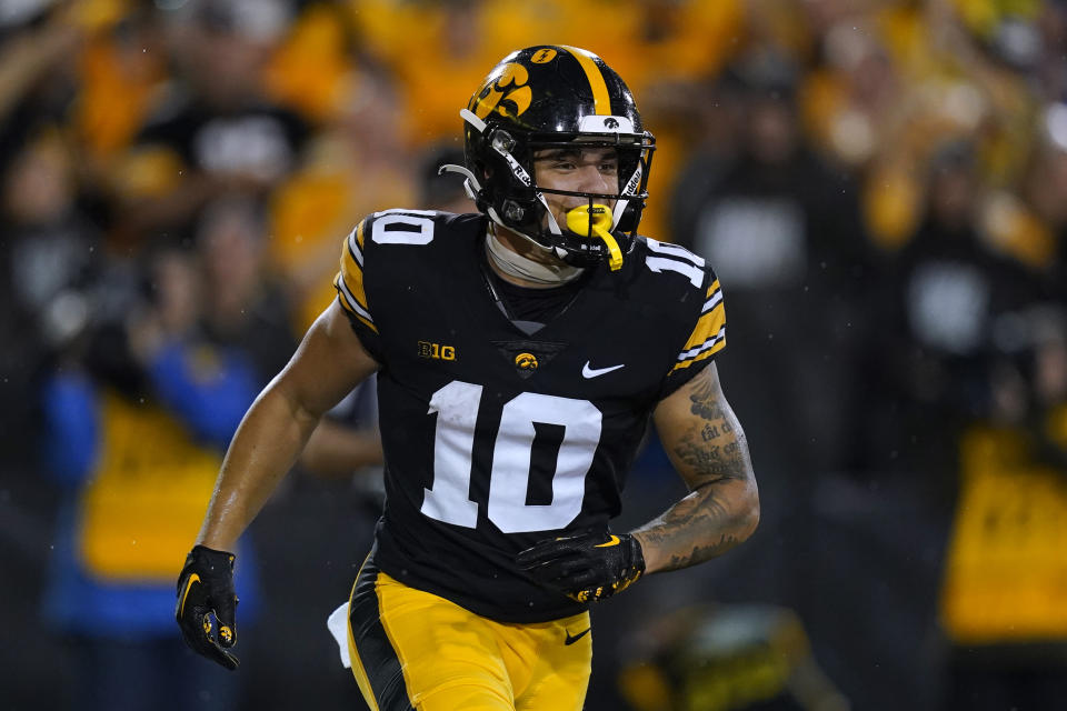 FILE - Iowa wide receiver Arland Bruce IV runs off the field after catching a touchdown pass during the first half of an NCAA college football game against Nevada, Sept. 17, 2022, in Iowa City, Iowa. Bruce is among eight ISU and Iowa football players or staffers facing criminal charges Thursday, Aug. 10, 2023, in connection with the state's investigation into sports wagering at the two schools. (AP Photo/Charlie Neibergall, File)