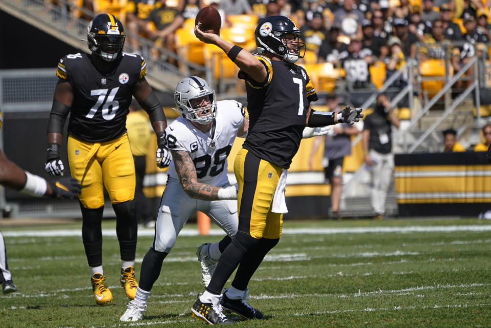 Pittsburgh Steelers quarterback Ben Roethlisberger (7) throws a pass under pressure by Las Vegas Raiders defensive end Maxx Crosby (98) during the first half of an NFL football game in Pittsburgh, Sunday, Sept. 19, 2021. (AP Photo/Keith Srakocic)