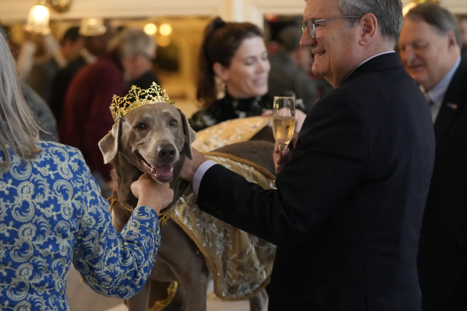 Her Majesty XXX, Queen Billie Jean King Gelderman, queen of the Krewe of Barkus, a Mardi Gras dog parade, is introduced at the krewe's traditional Friday lunch dressed in royal attire at historic Galatoire's Restaurant in New Orleans, Friday, Feb. 10, 2023. The Barkus parade, open to public and their dogs by registering for the event, goes through the French Quarter on Sunday, Feb. 12, 2023. (AP Photo/Gerald Herbert)